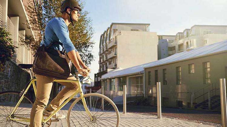 Young professional riding a bike to work.